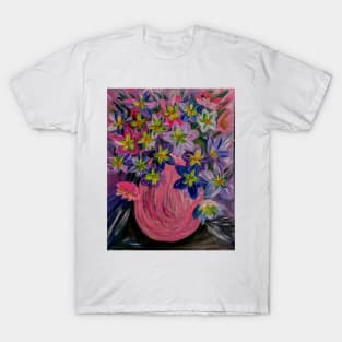 A fun and bright vibrant bouquet of flowers in a pink vase . T-Shirt